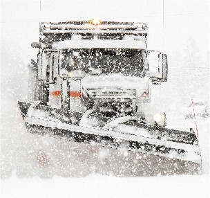 Cover Photo: Truck plowing snow.